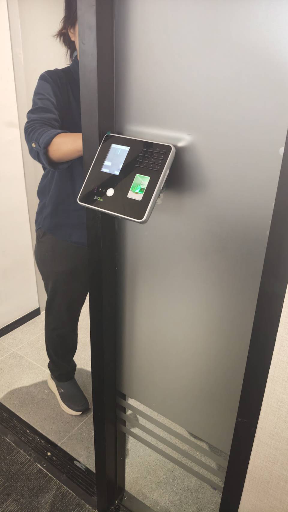 Detail view of ZKTeco biometric device installation